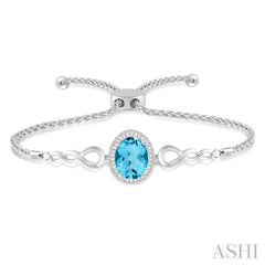 10X8 MM Oval Shape Blue Topaz and 1/20 Ctw Round shape Diamond Sterling Silver Lariat Bracelet